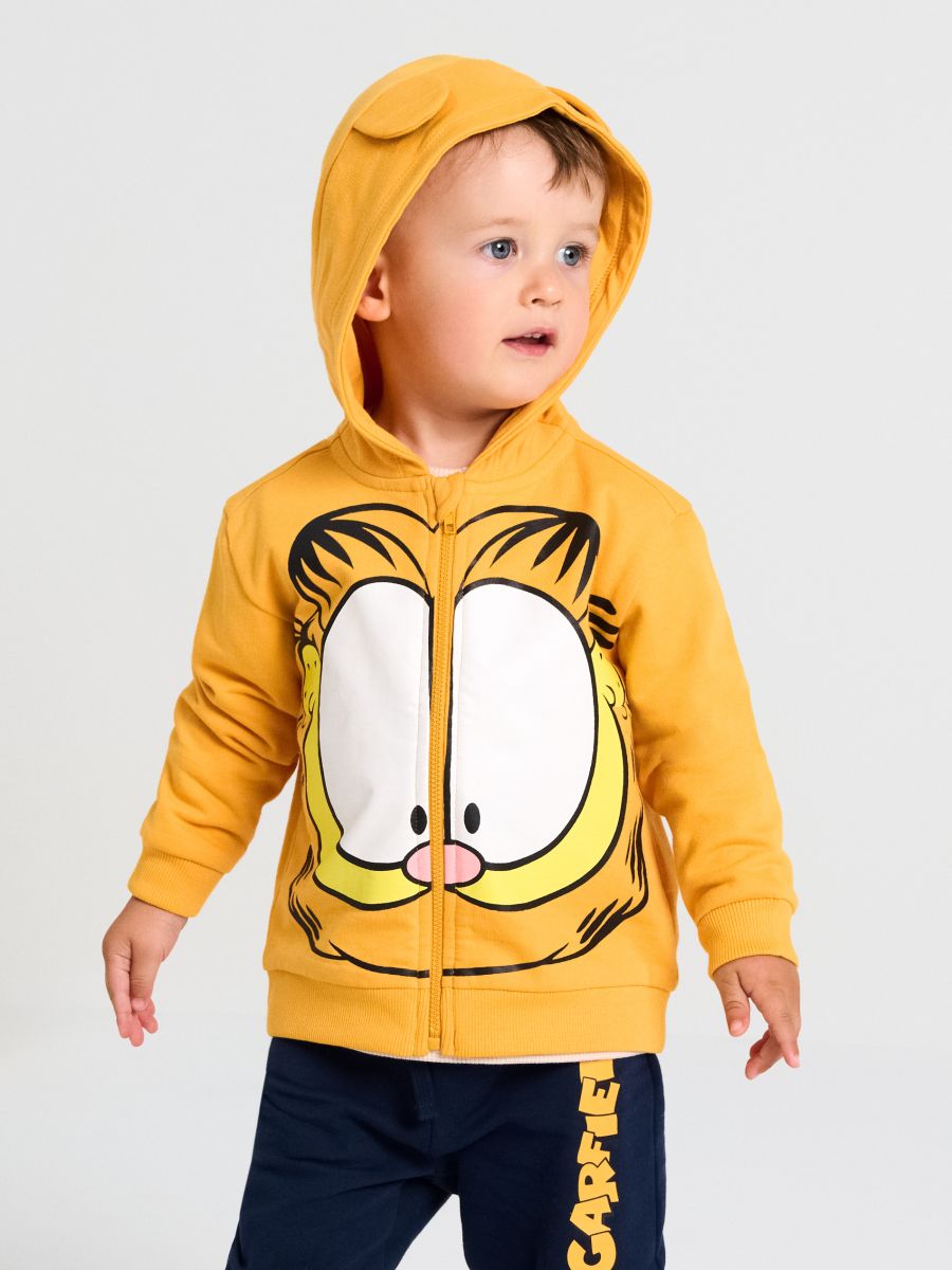Bawełniana bluza z nadrukiem Garfield Bawełniana bluza z nadrukiem Garfield - pomarańczowy - SINSAY