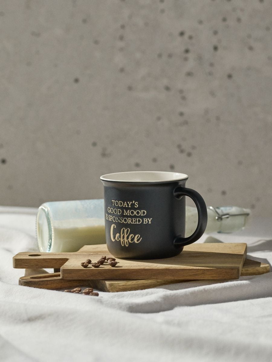 Ceramiczny kubek z napisem Today’s Good Mood Is Sponsored By Coffee - czarny - SINSAY