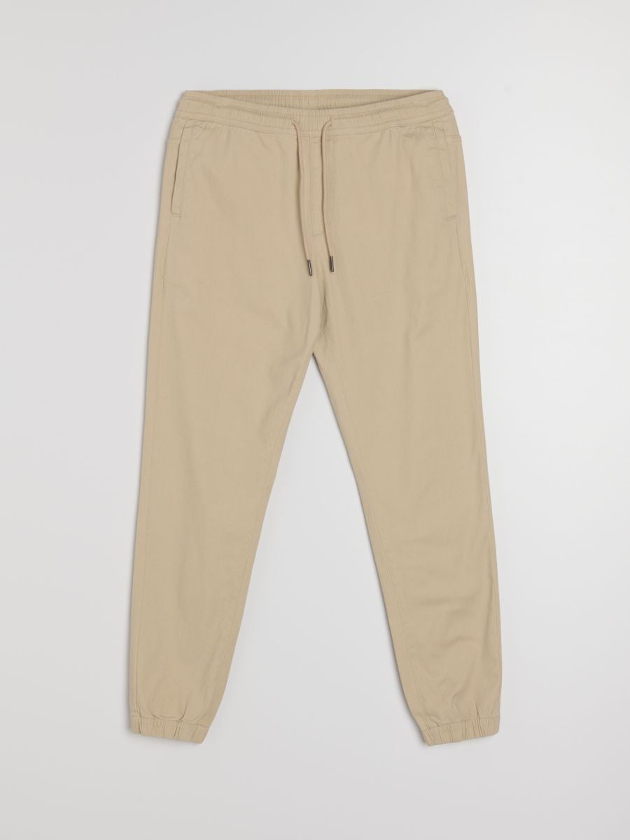 Pantaloni din bumbac jogger - bej - SINSAY