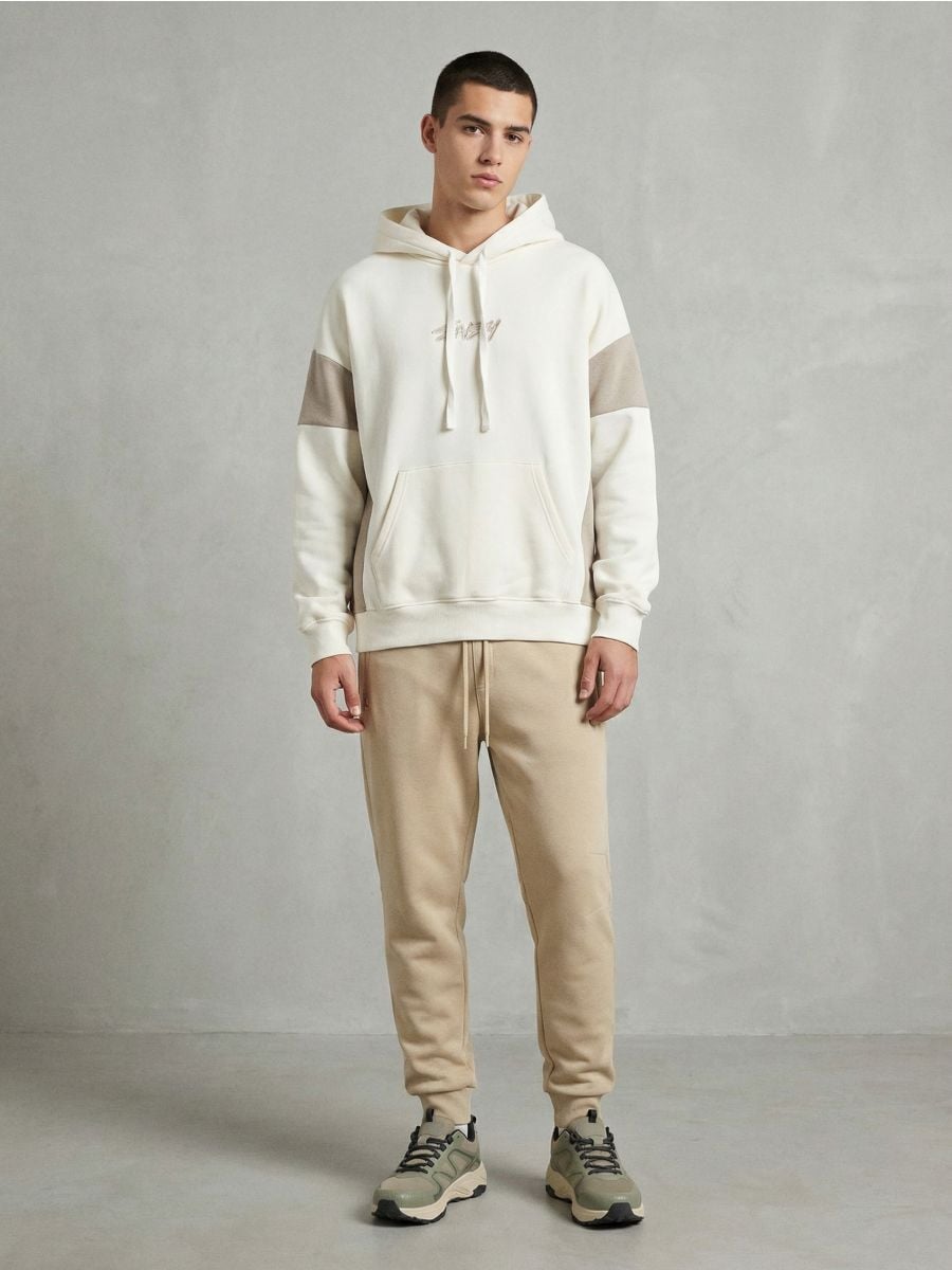 Spodnie dresowe jogger Spodnie dresowe jogger - beżowy - SINSAY