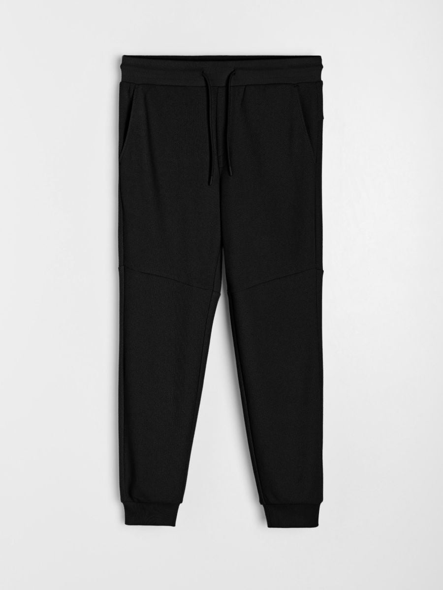 Pantaloni jogger de trening din material piqué Pantaloni jogger de trening din material piqué - negru - SINSAY
