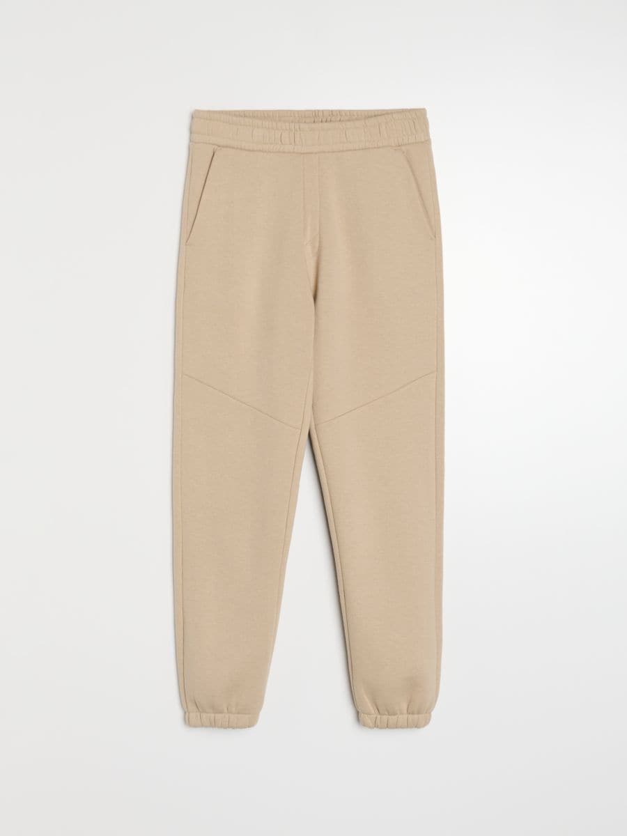 Spodnie dresowe regular fit Spodnie dresowe regular fit - beżowy - SINSAY